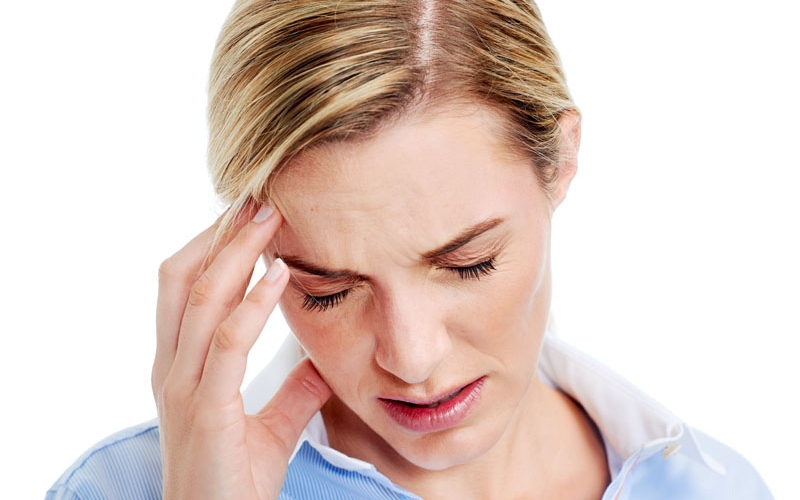 Young businesswoman has splitting headache pain migraine